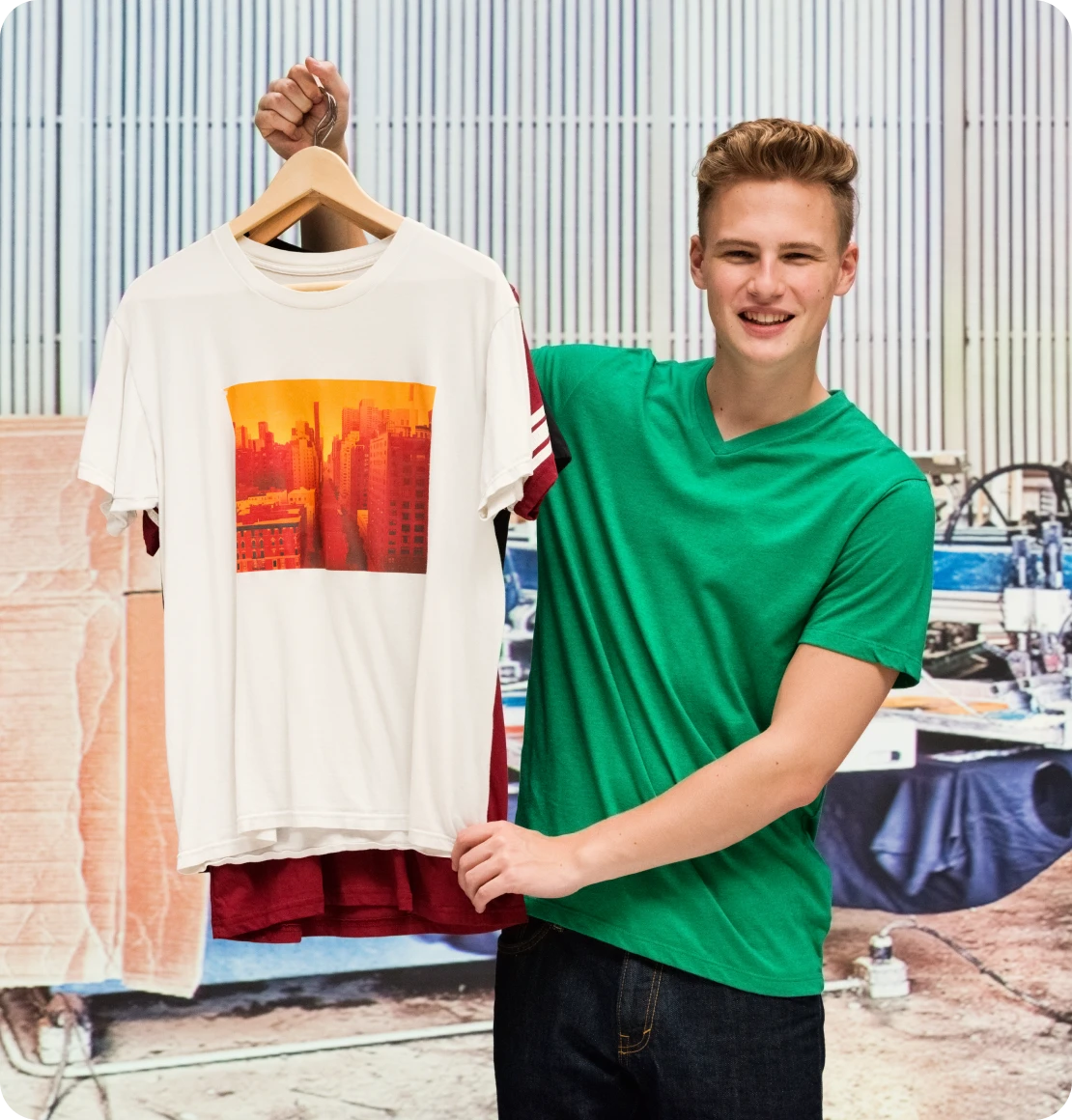 Smiling individual with a shirt display